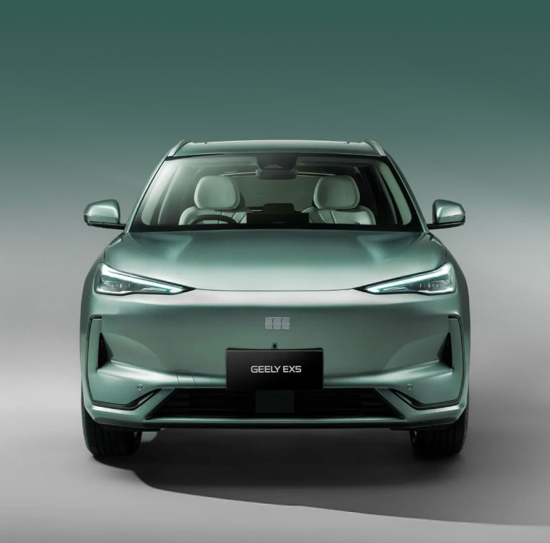 Head on view of metallic green Geely EX5