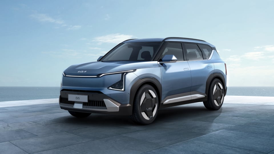 Angled view of the Kia EV5 showing off the front and side of the futuristic-looking body