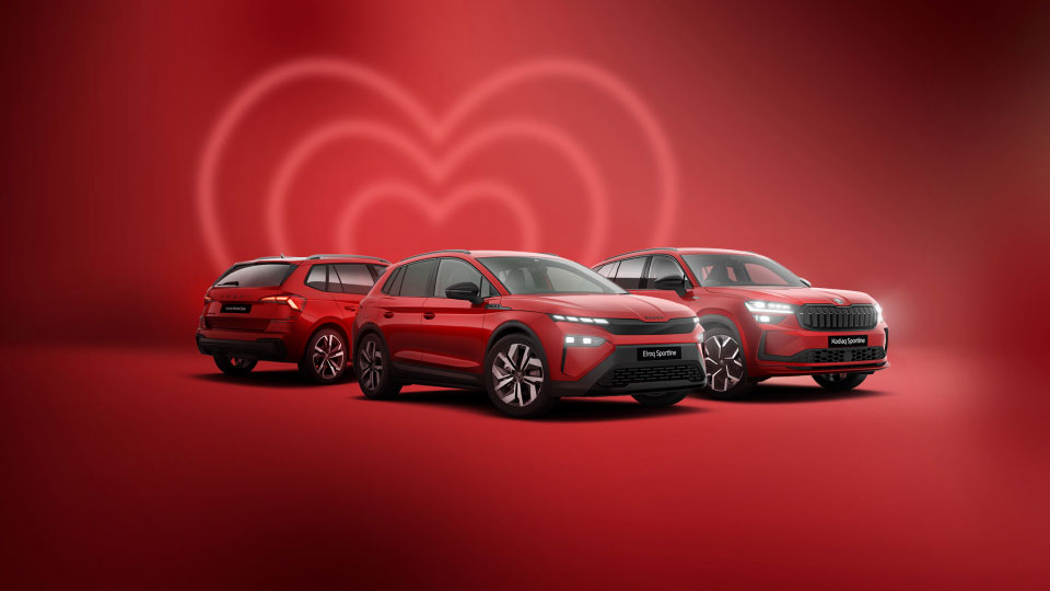 Škoda range of models against a red background with a faint love heart