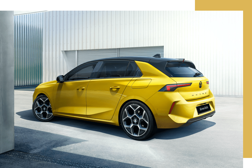 Rear side on view of yellow Vauxhall Astra