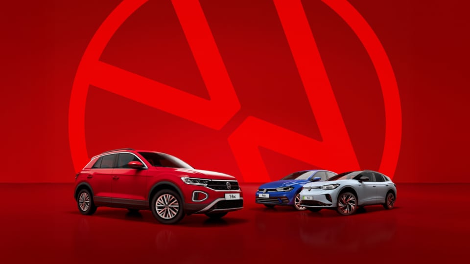 Front angled view of three Volkswagen vehicles